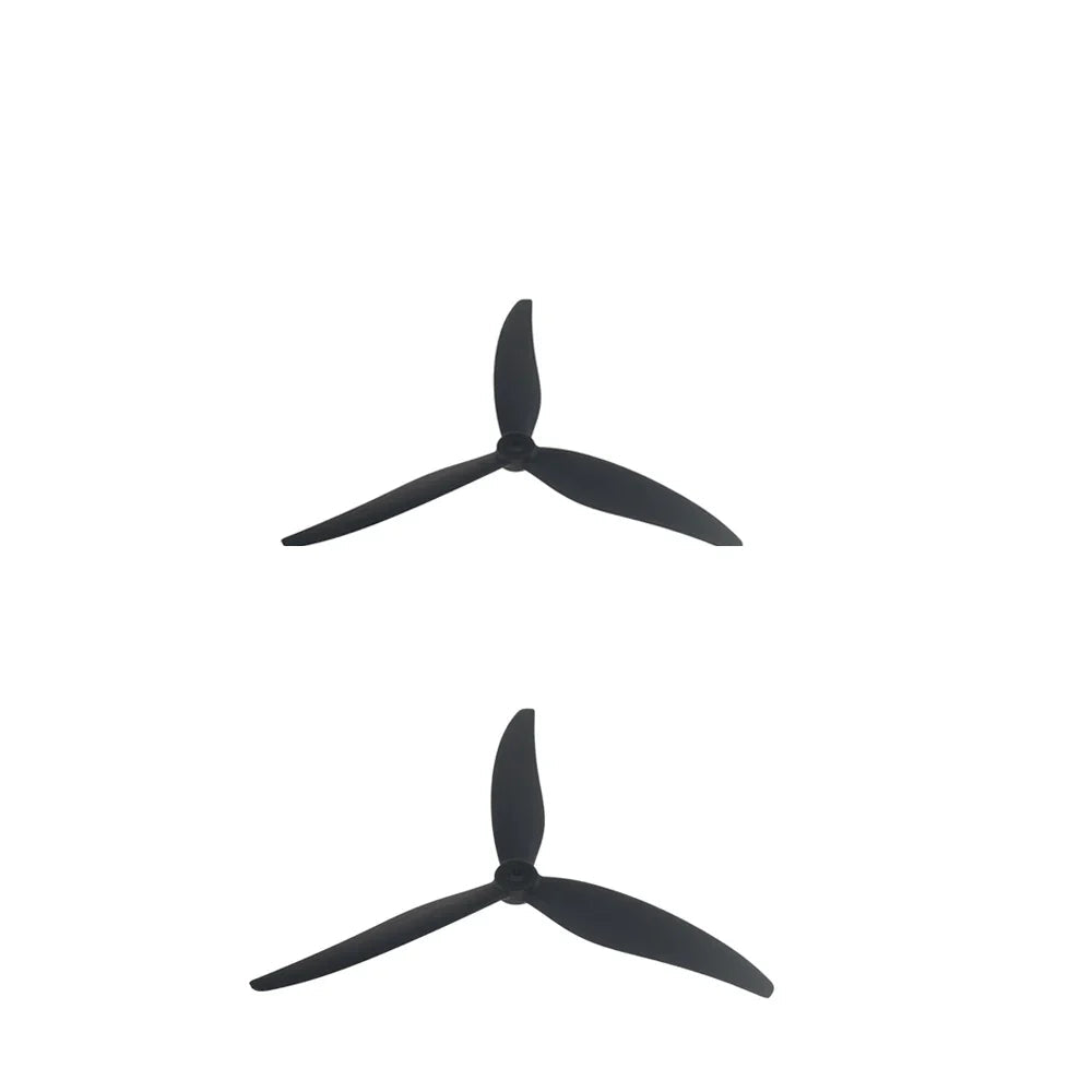 Two black 3-blade FPV drone propellers shown from above, stacked vertically on white background