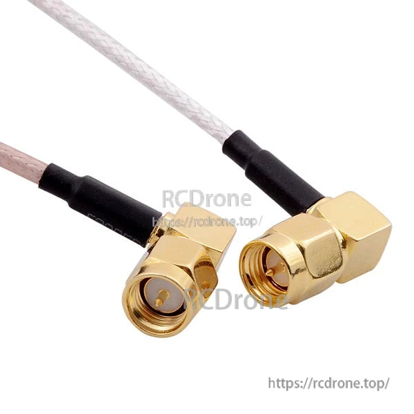 Close-up of gold right-angle SMA male connectors on coax leads, showing pin and threaded nut detail