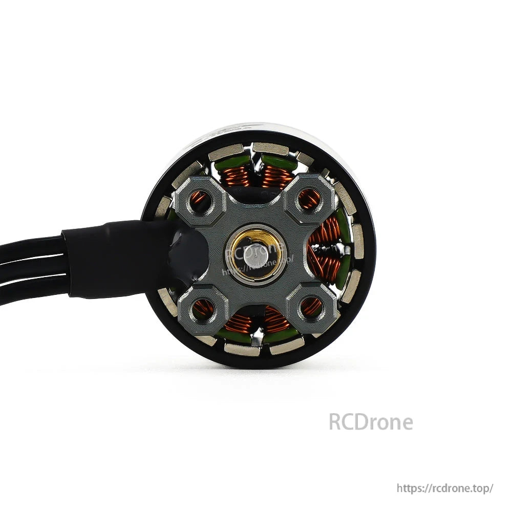 Axisflying Cine157-2 brushless FPV motor close-up showing mounting plate, copper windings, and wire lead