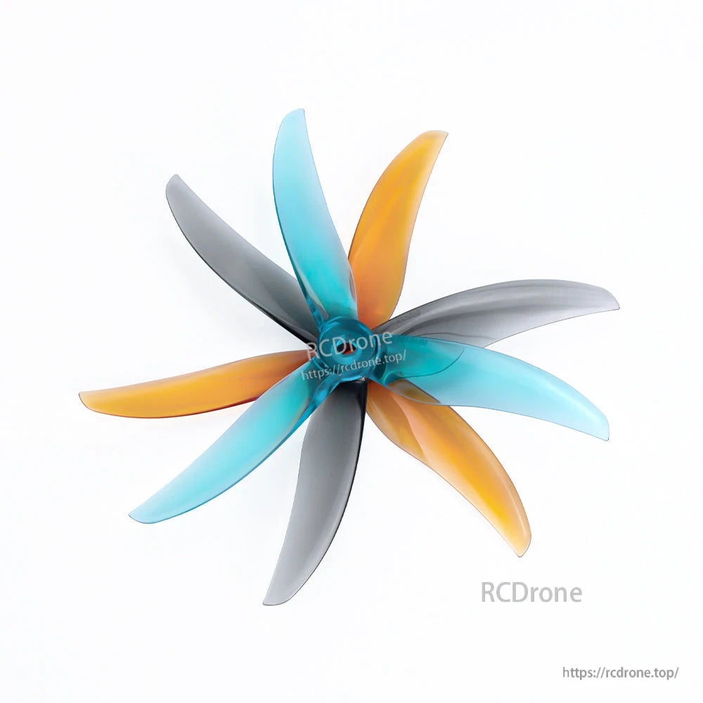 Axisflying x BlackBird V3 BB39 freestyle drone propellers with three-blade design in blue, orange, and gray
