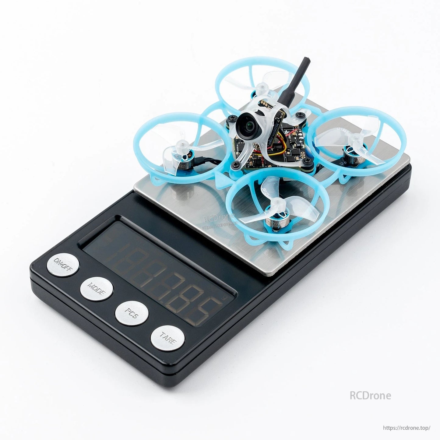 BETAFPV micro whoop FPV quadcopter with blue ducted prop guards sitting on a digital scale