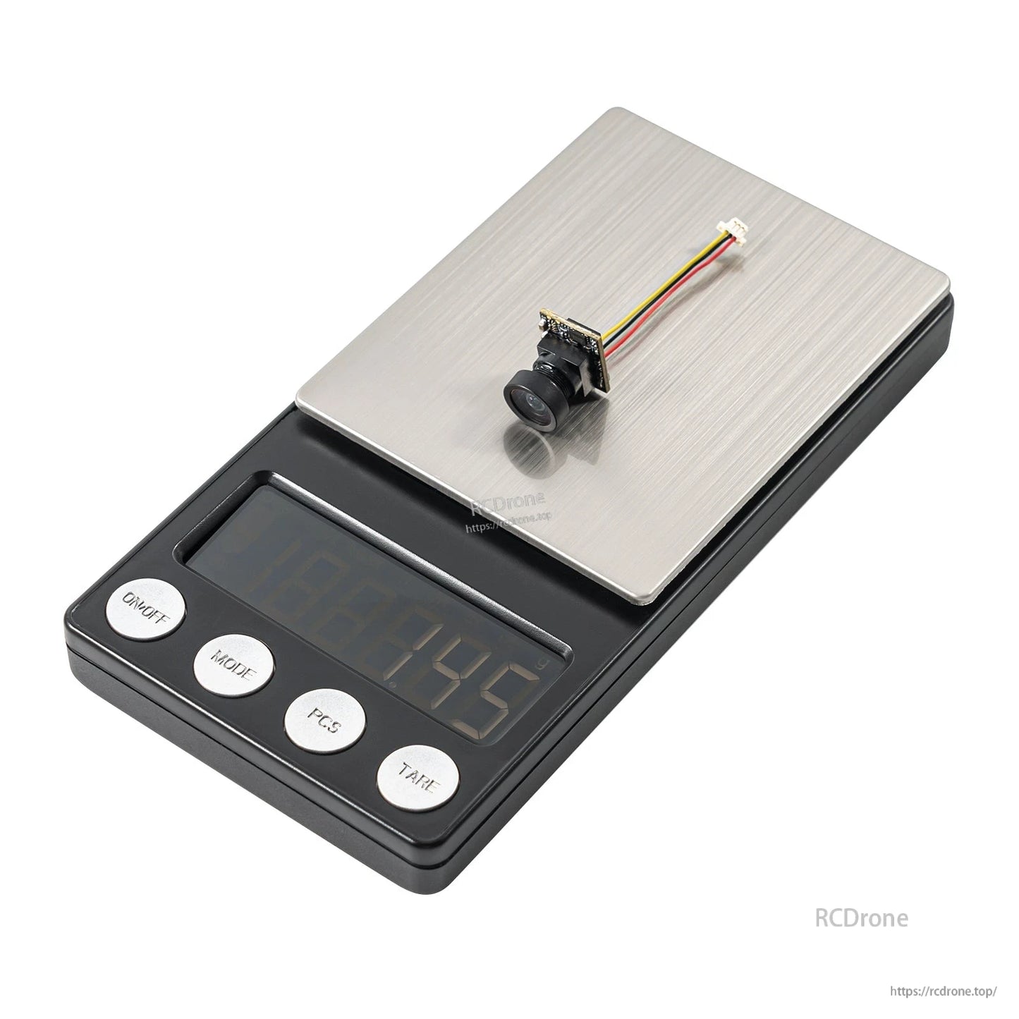 Micro FPV camera with wired connector placed on a digital scale for weight reference