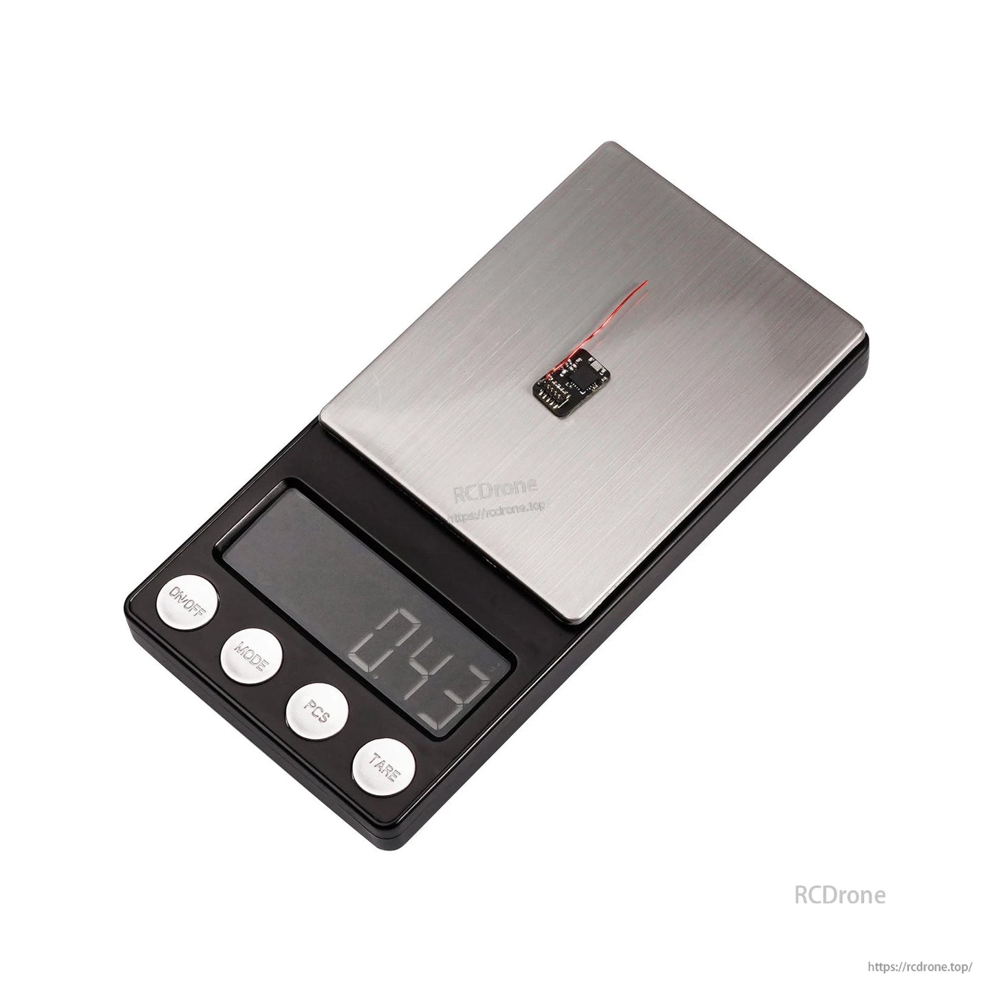 Micro receiver module on digital scale showing 0.43 g weight
