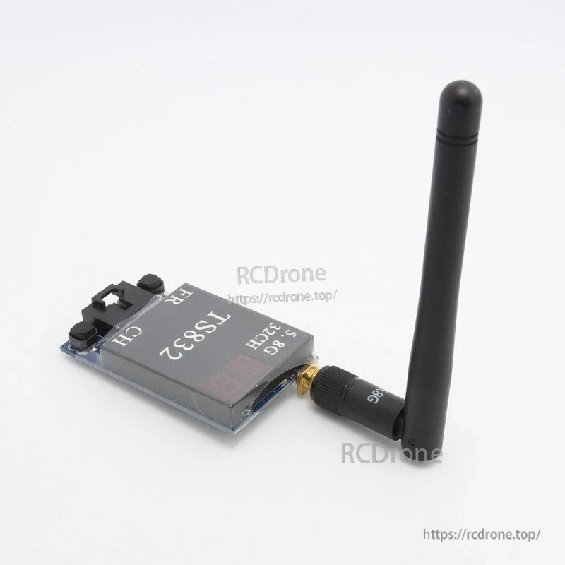 TS832 transmitter side angle with antenna attached, showing control buttons and compact module shape