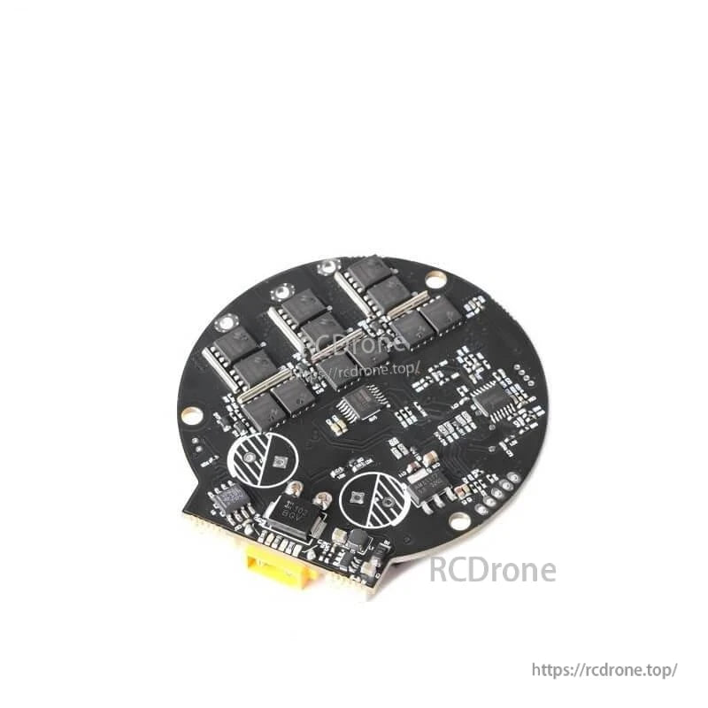 Angled underside close-up of MOSFET power stage and edge connector on round motor driver PCB