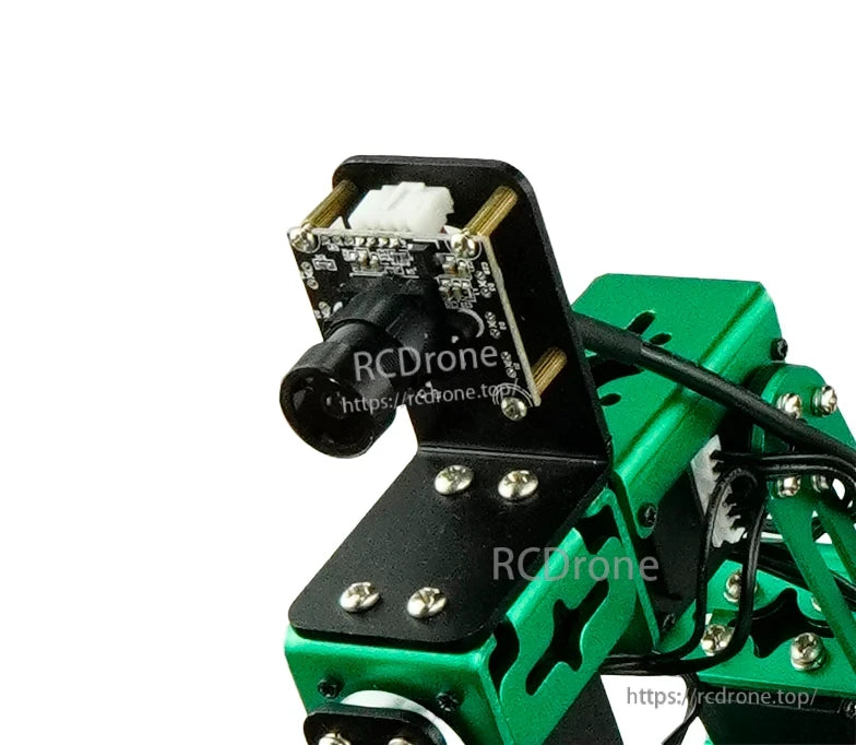 Close-up of camera board and lens on bracket, showing connector and mounting screws on robot frame