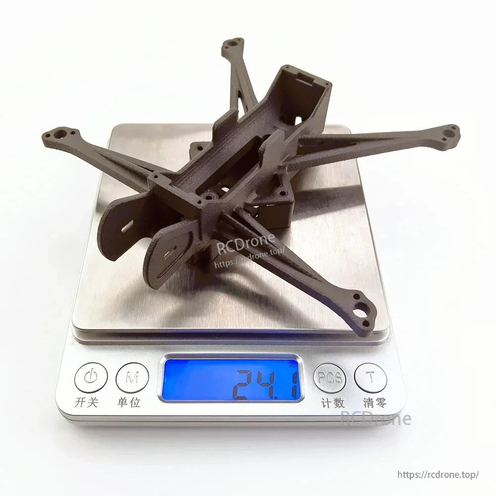 FPV frame shown on digital scale with 24.1 g weight reading