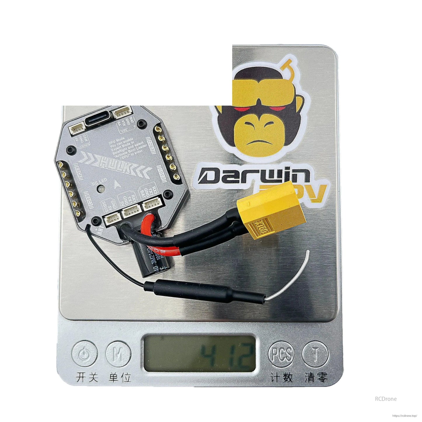 HULK AIO flight controller on digital scale showing 41.3 g weight with XT60 lead attached