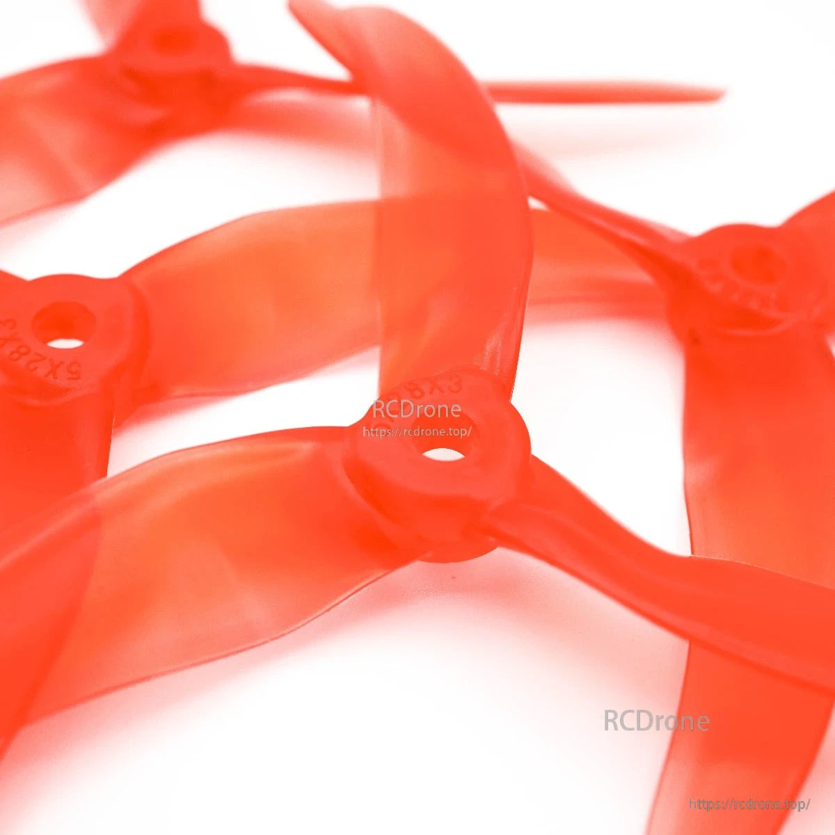 Close-up of multiple propeller hubs showing 5x2.8 size markings and center holes