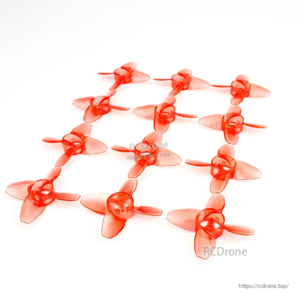 Grid layout of translucent red 4-blade micro drone propellers on white background