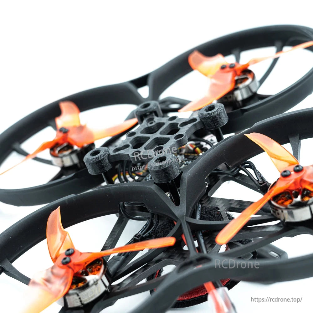 Top close-up of duct guards and orange propellers with central frame and wiring visible