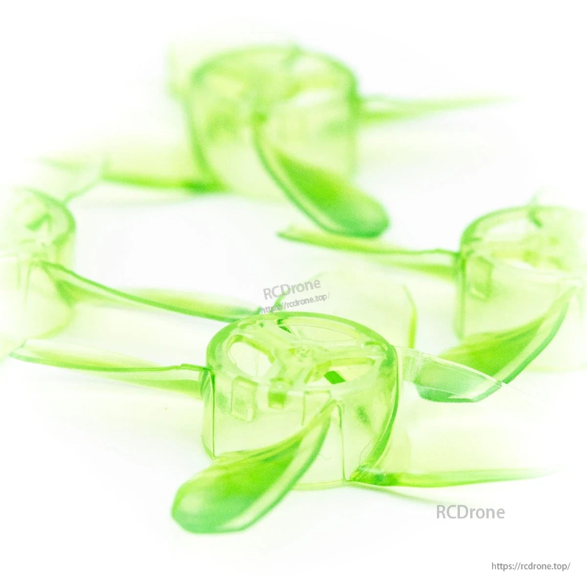 Macro close-up of translucent green propeller blades and hub, showing blade curvature