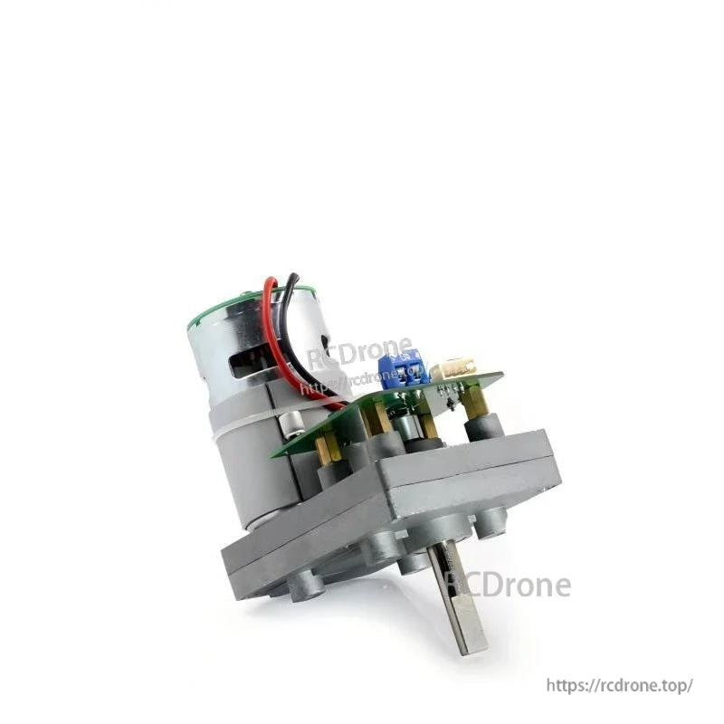 Control board close-up on servo base with blue screw terminal and white plug connectors, side angle