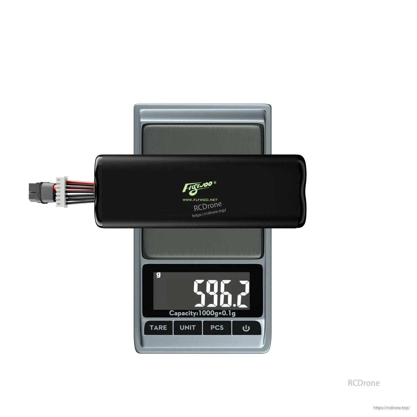 Flywoo Li-ion drone battery pack with XT60 and balance lead on digital scale reading 596.2 g