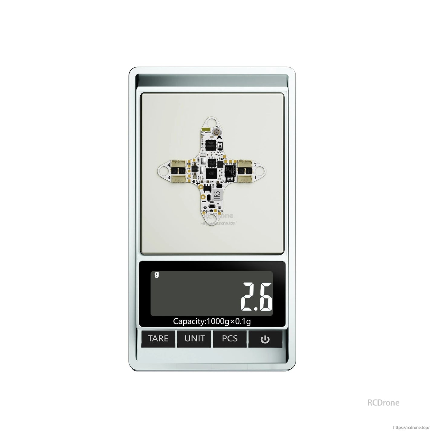 Flywoo GOKU F405 HD 1S AIO flight controller/ESC board on a digital scale showing 2.6 g weight