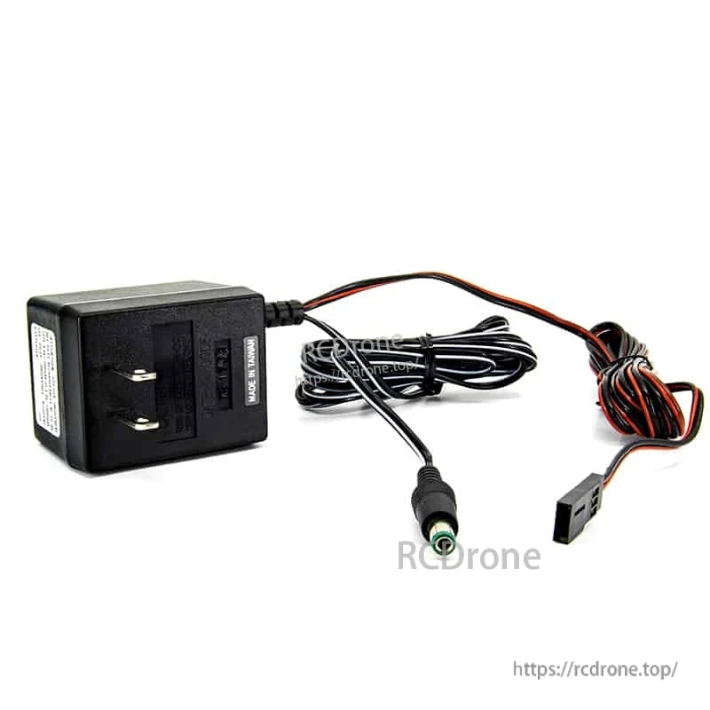 Wall plug AC adapter with attached cable, barrel-style connector and 2-pin plug on white background