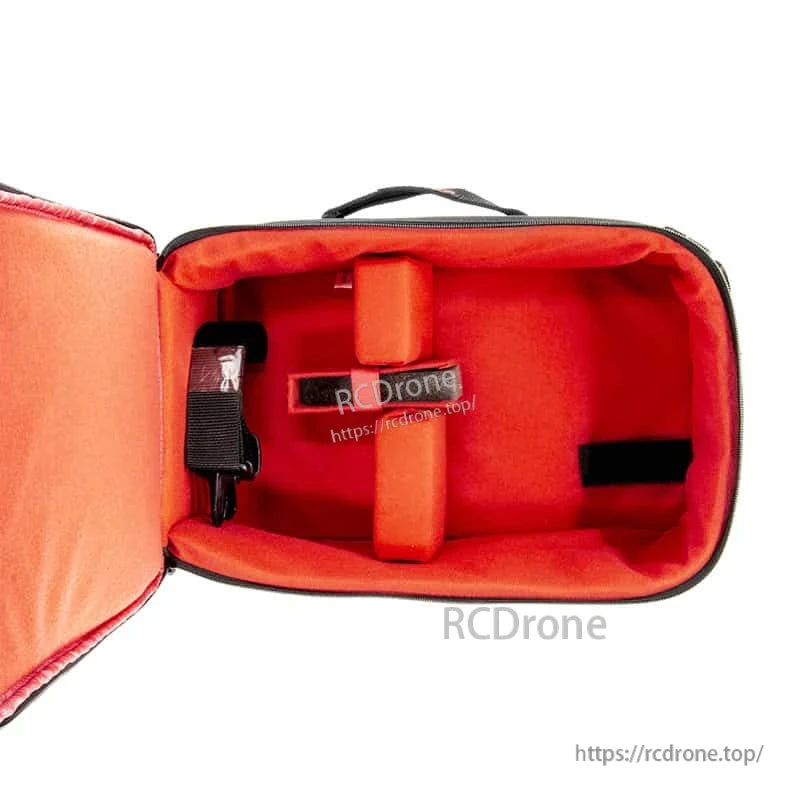 Red padded interior of transmitter bag with center divider pad and side strap attachment