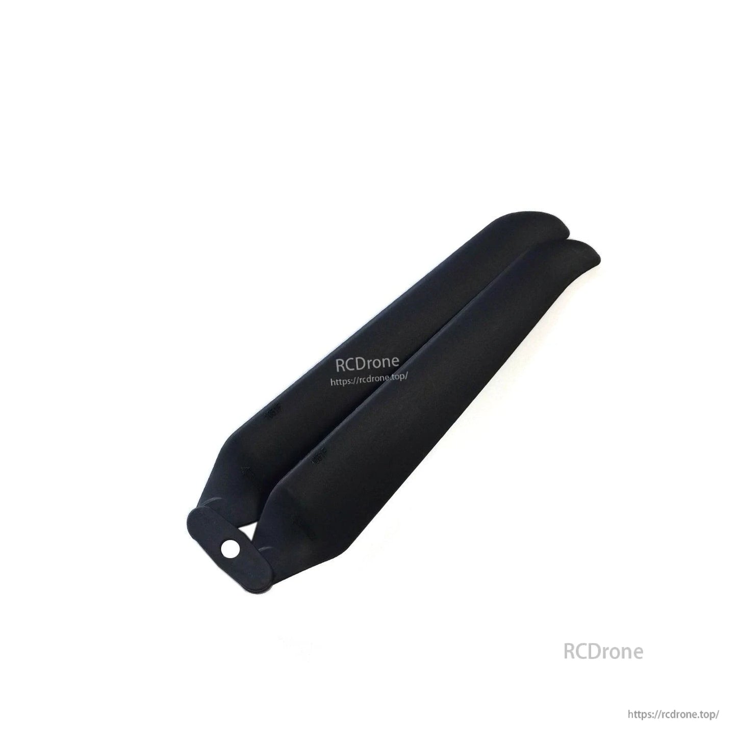 Close-up of folded black propeller pair with center mounting hole at hub
