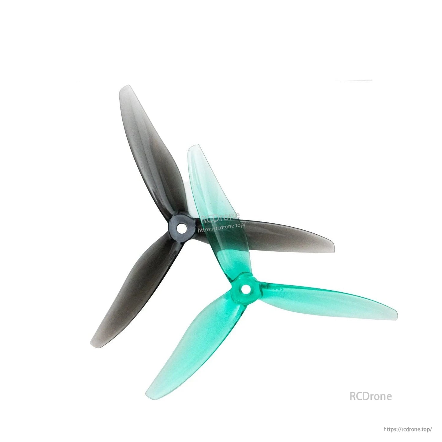 Smoke gray and translucent teal 3-blade propellers overlapped to compare colors and blade profile