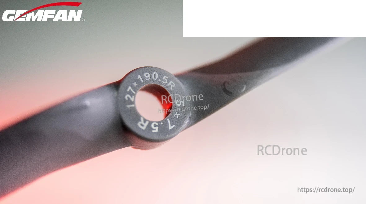 Close-up of propeller hub with molded size/pitch markings and blade root detail