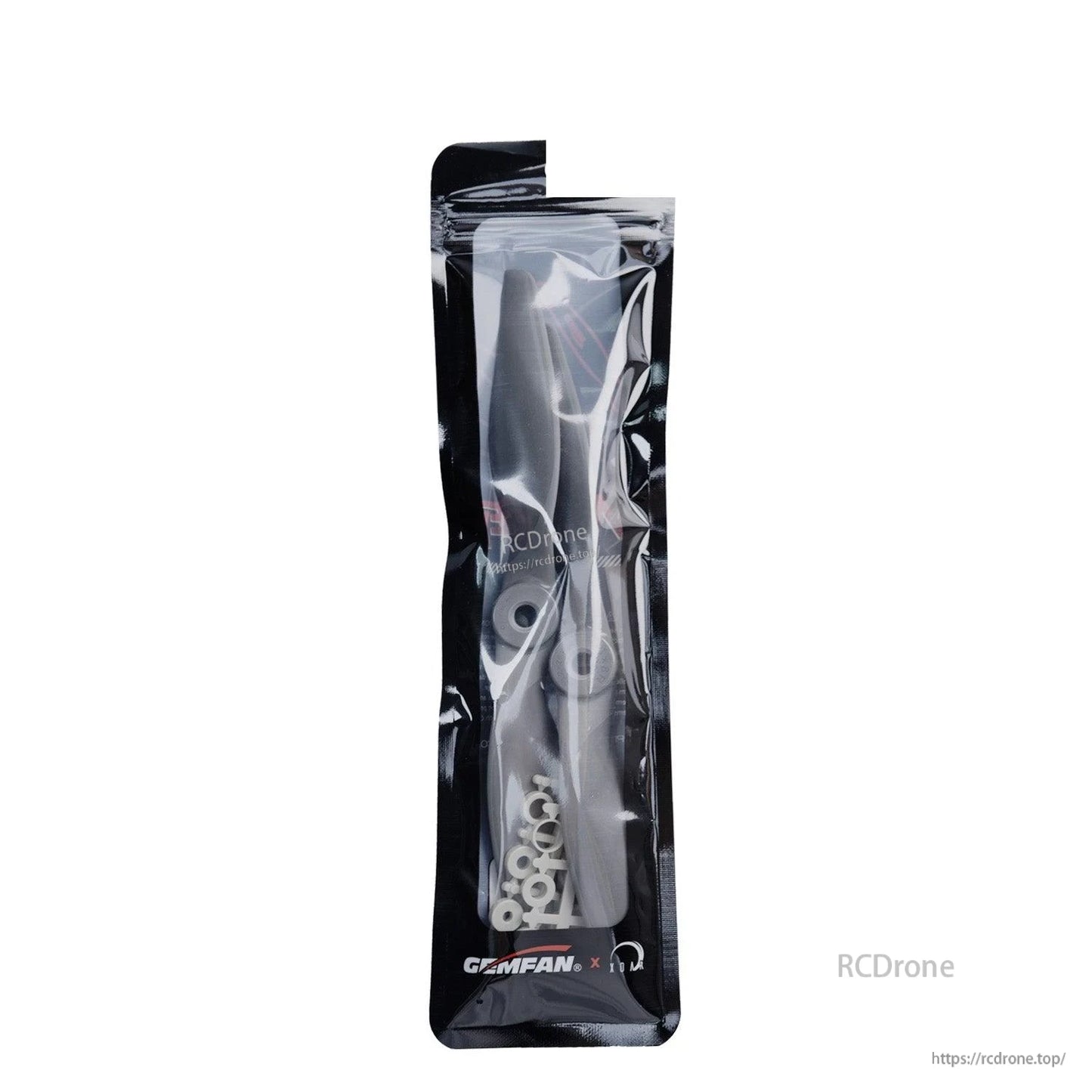 Gemfan propeller set in clear retail pouch, close-up of packaging and included adapter rings