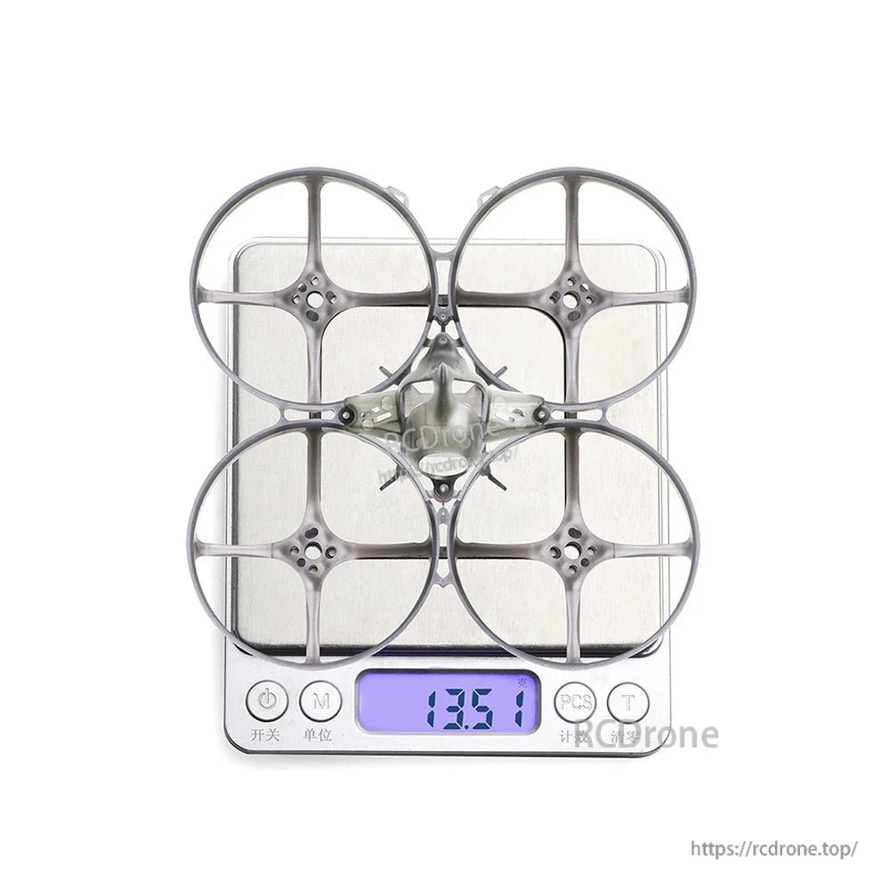 Whoop frame on digital scale showing 13.51 g weight with canopy installed