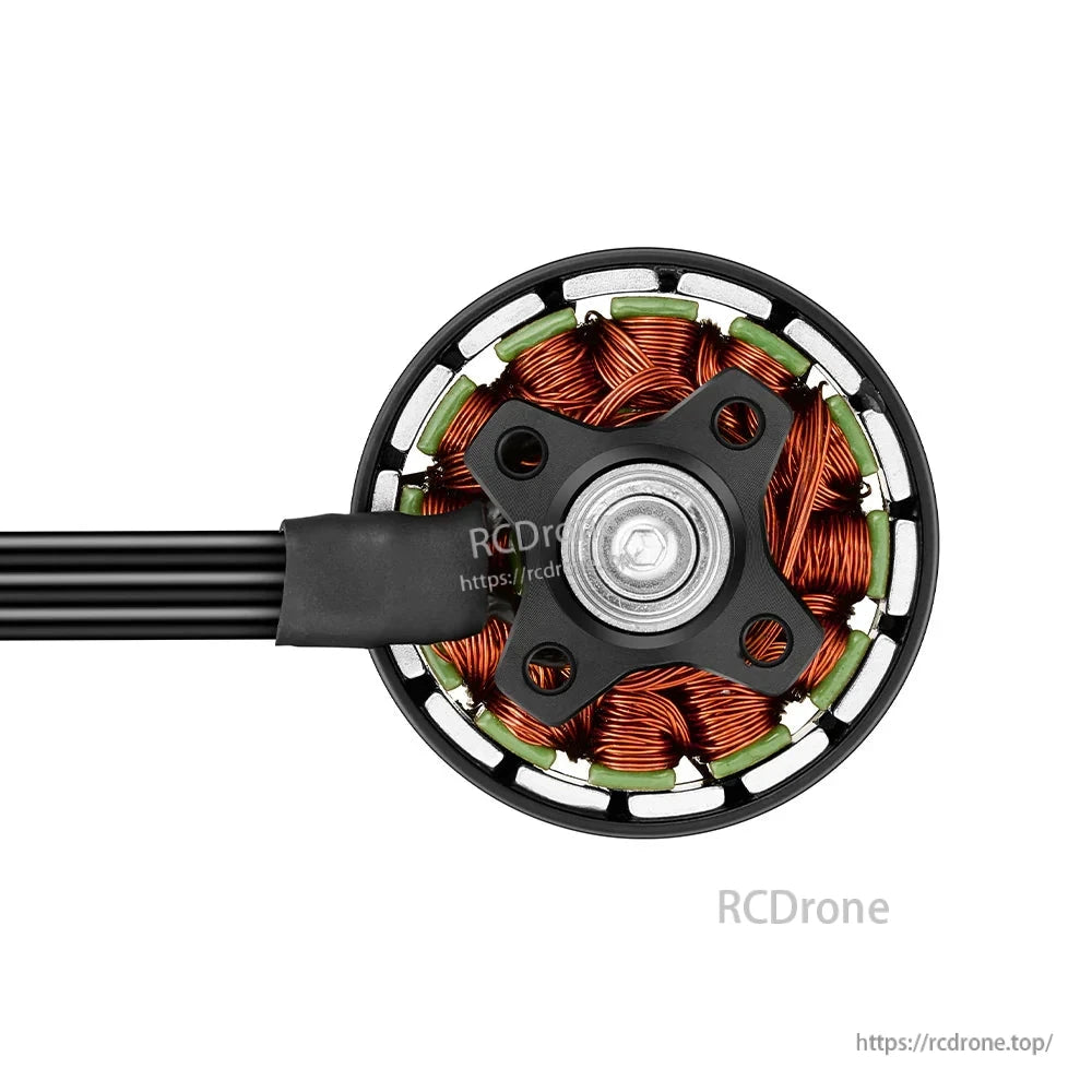 Bottom view of Hobbywing XRotor 3110 brushless FPV motor showing copper windings, mounting base, and lead wires