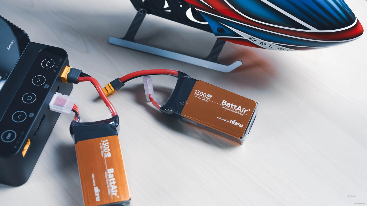 ISDT BattAir Smart Battery, ISDT BattAir smart LiPo battery packs labeled 1300mAh connected to a charger with balance lead and XT60 plug