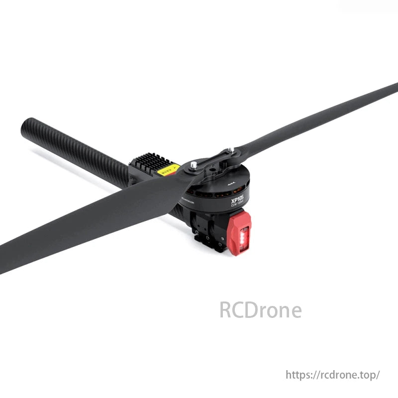 A black drone propeller, featuring a red light and yellow label, is showcased on a white background.