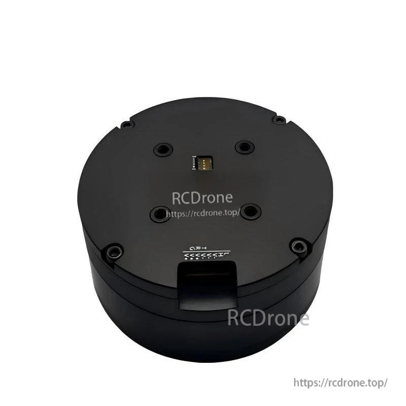 Top view of round servo motor housing with mounting holes and small connector port, RCDRone watermark overlay