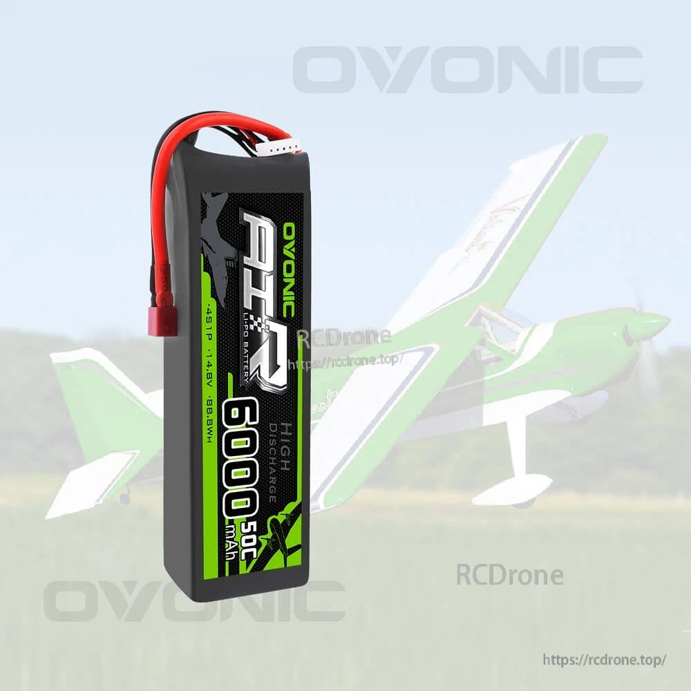 OVONIC 4S 14.8V 6000mAh 50C LiPo battery standing upright on RC plane background