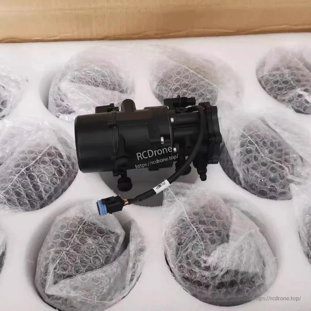 Original DJI AGRAS T30 Water Pump, DJI Agras T30 water pump assembly with attached signal cable and blue connector, packaged in foam insert