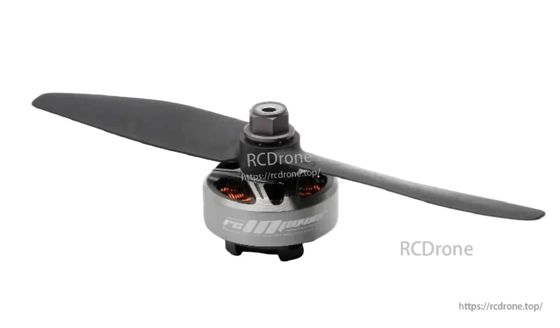 RCINPOWER GTS V2 2306 brushless FPV drone motor with two-blade propeller, gray bell and visible copper windings