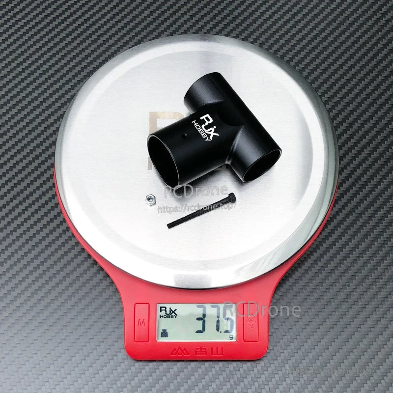 RJX Hobby aluminum tee tube connector joint with bolt and nut, shown on a scale at 37.5 g