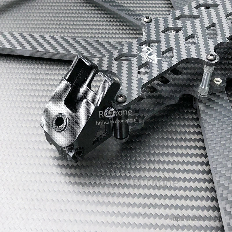 Close-up of RJX DF13 carbon fiber FPV drone frame plate with black TPU mount, standoffs and screws