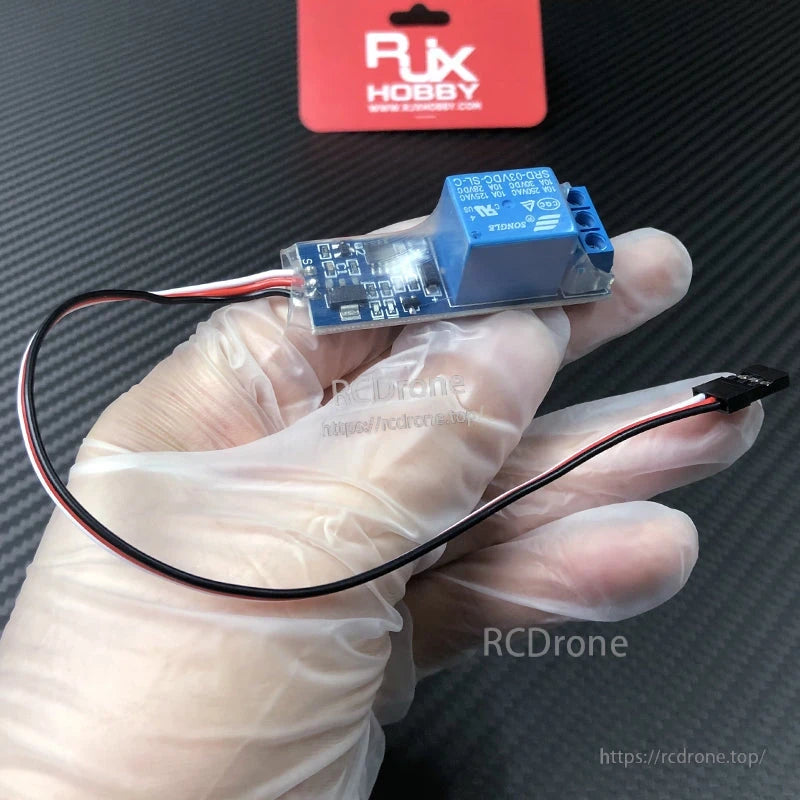 RJX RC PWM electronic relay switch module with blue relay, 3-wire servo lead, and screw terminal output
