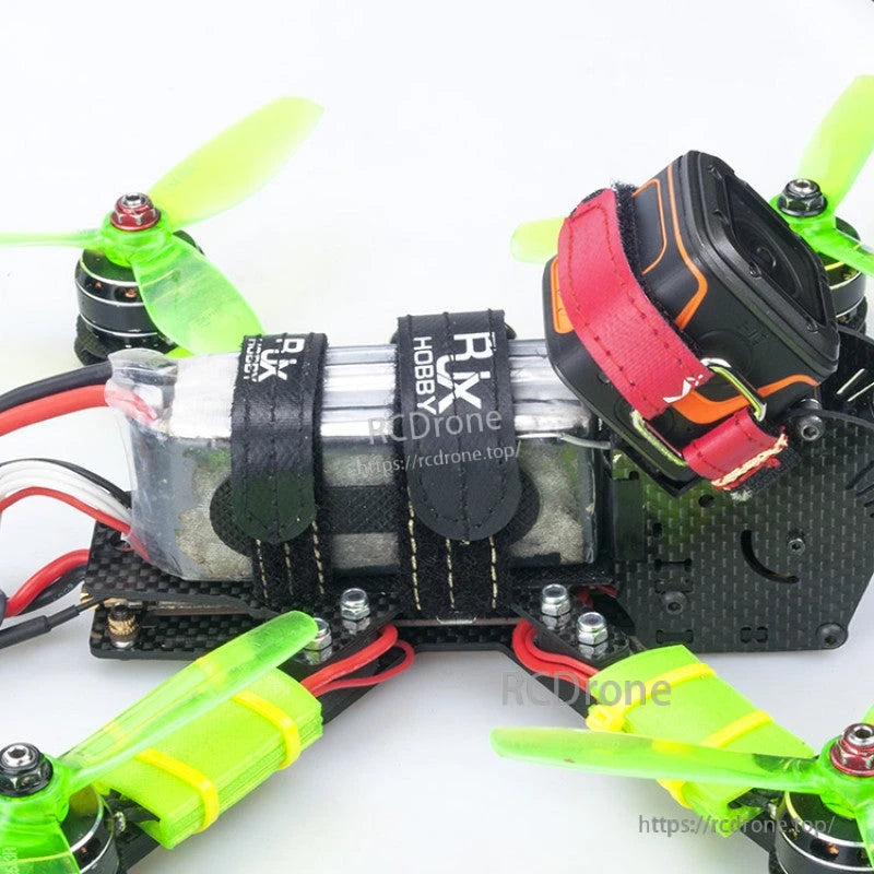 RJXHOBBY kevlar stitched battery strap securing a LiPo pack on an FPV racing quad frame