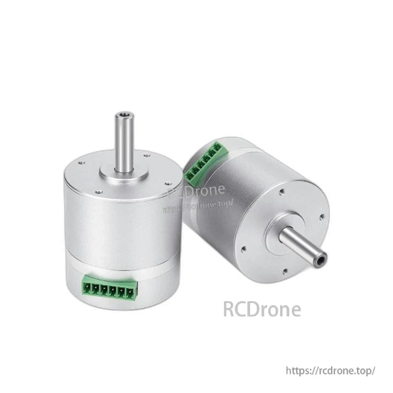 Angled view of two servo motors showing side profile, output shafts, and green terminal blocks