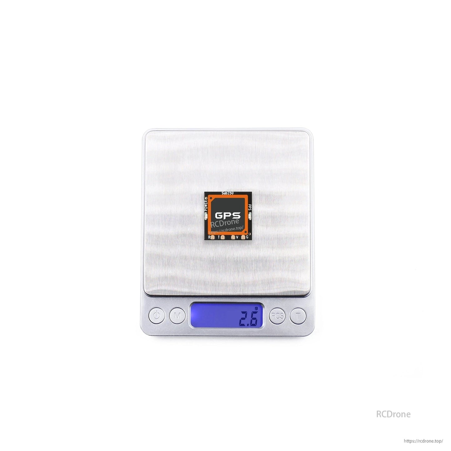 GPS module on digital scale showing 2.8 g weight reading