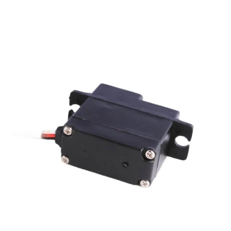 Underside of the black servo showing four silver corner screws, mounting tabs, and wiring exiting the side.