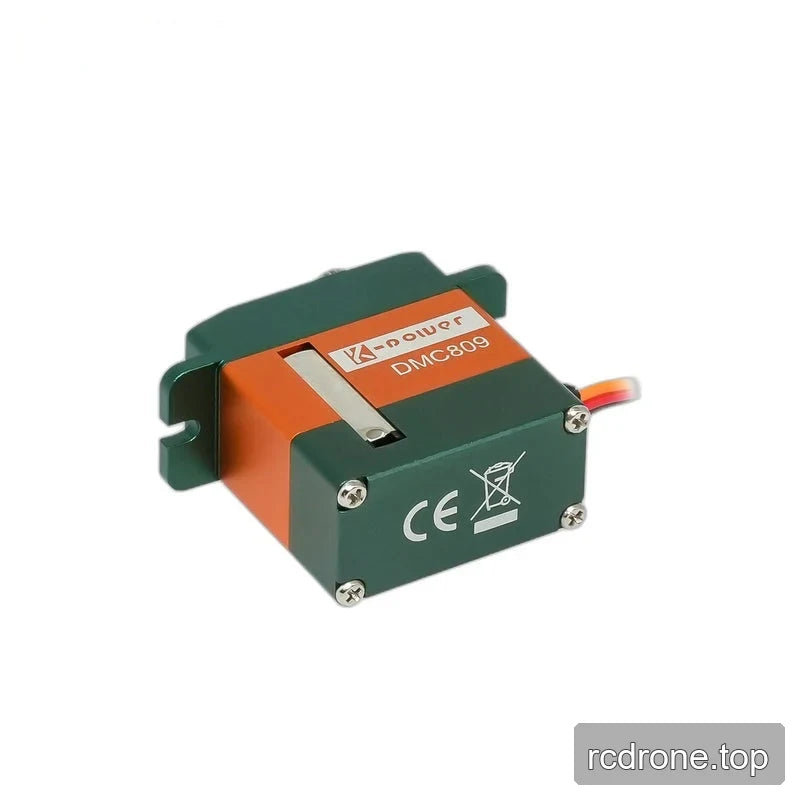 Tilted green and orange servo showing its four-screw bottom plate, CE and crossed-out bin markings, and DMC809 side label.