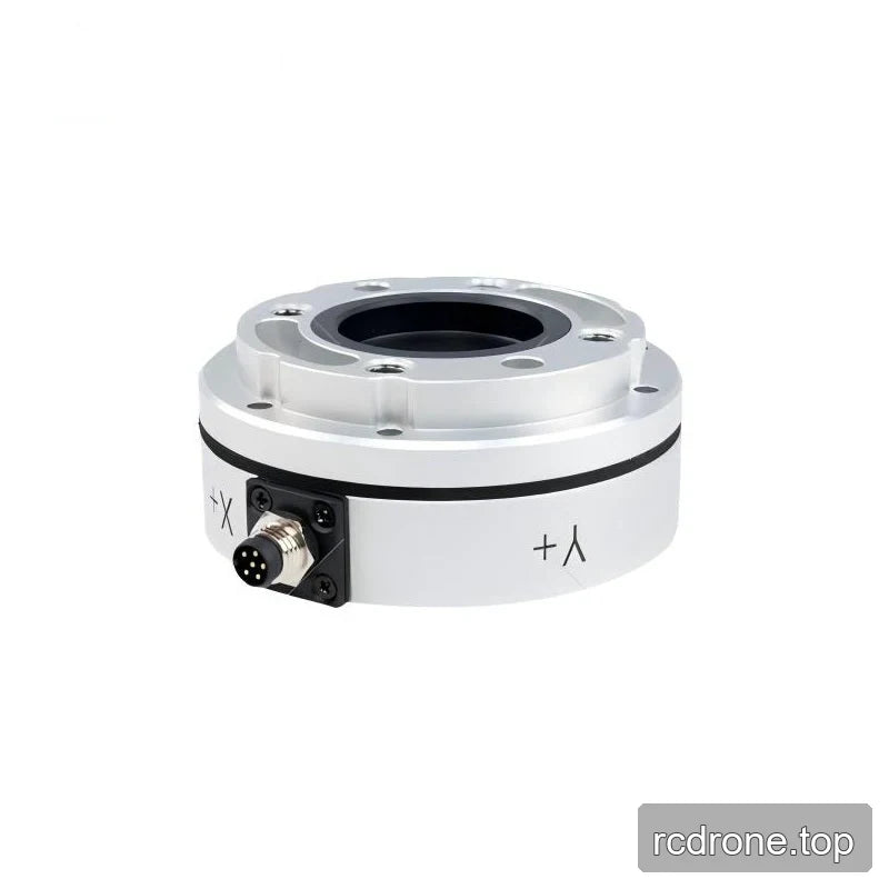 Silver sensor at an oblique angle, with raised mounting ring, central recess, left-front connector, and visible axis markings.