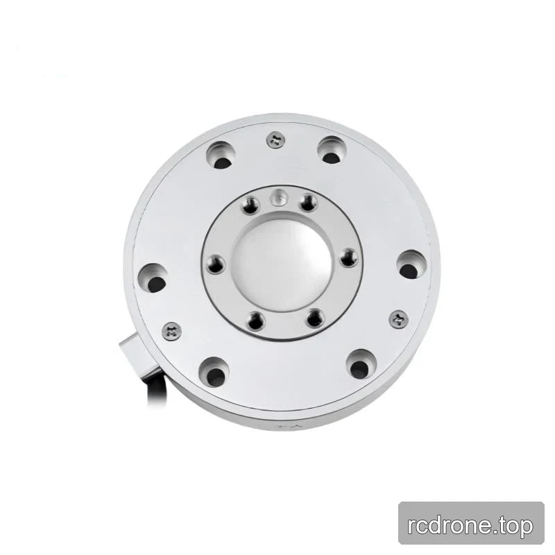 Near-overhead view of the sensor face with concentric rings of mounting holes and a cable outlet at the lower left.
