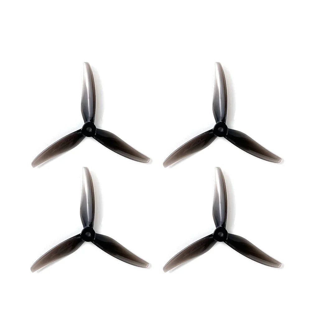 Set of four black 3-blade FPV drone propellers, matching tri-blade design