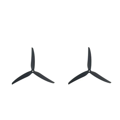 Two black tri-blade propellers shown side by side, matching left and right rotation set