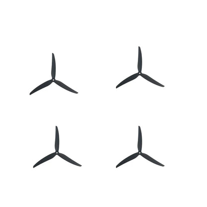 Set of four black tri-blade propellers arranged in a grid, 2 pairs for quadcopter use