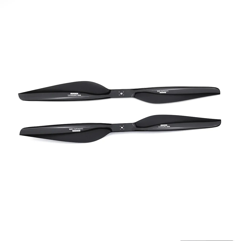 Pair of black MAD Components drone propellers with glossy finish and hub mounting holes
