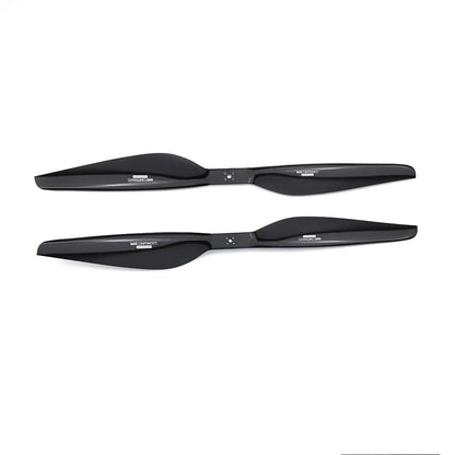 Pair of black MAD Components drone propellers with glossy finish and hub mounting holes