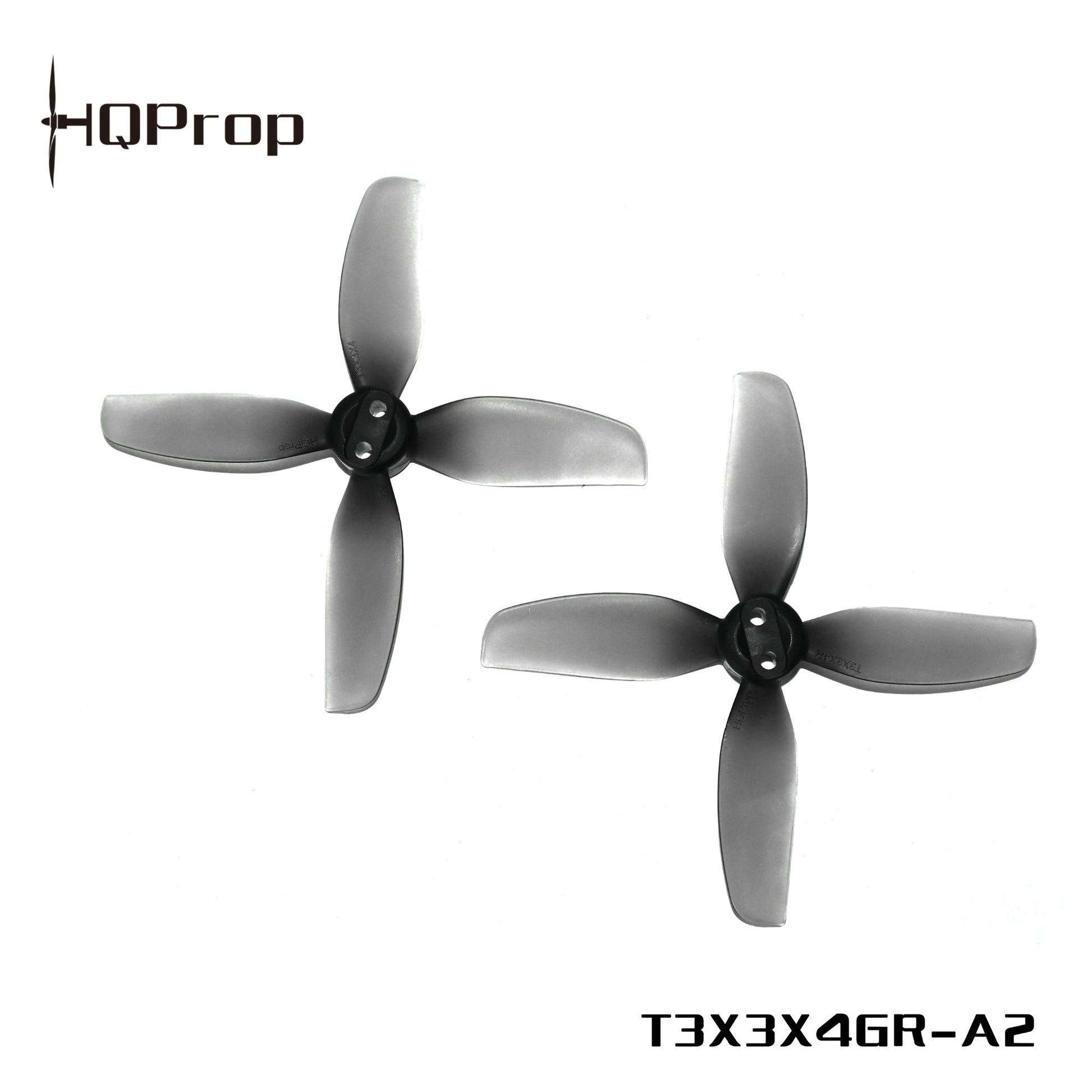 Two gray HQProp 4-blade drone propellers, model marking T3X3X4GR-A2