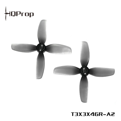 Two gray HQProp 4-blade drone propellers, model marking T3X3X4GR-A2